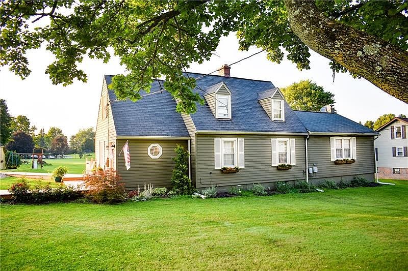 Welcome HOME to 1557 E. Laurel Circle!  Spectacular setting on 1.8 flat acres in Norvelt!
