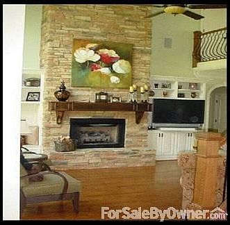 Living Room
						:
						17 foot stack stone fireplace, beautiful wrought iron stair case