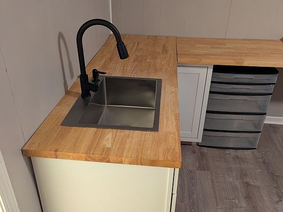 New kitchen countertop, sink, faucet and cabinets