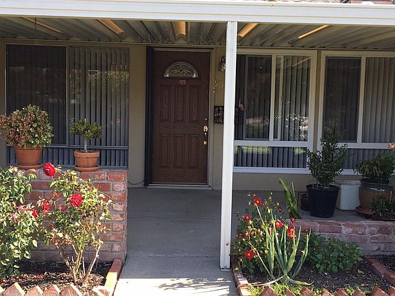 Front door with a patio.