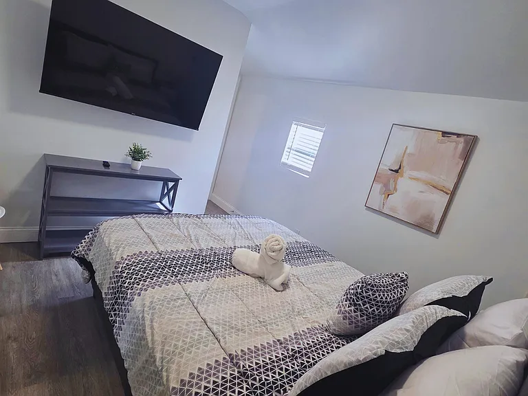 Includes towel set, premium linens, and a decorative table with chair
