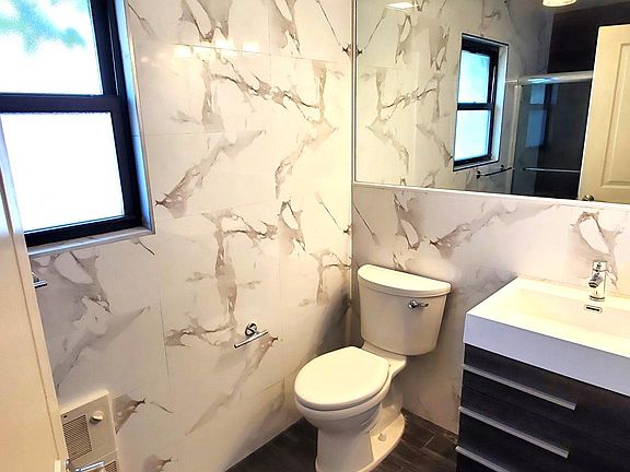 Updated bathroom with wall tiles