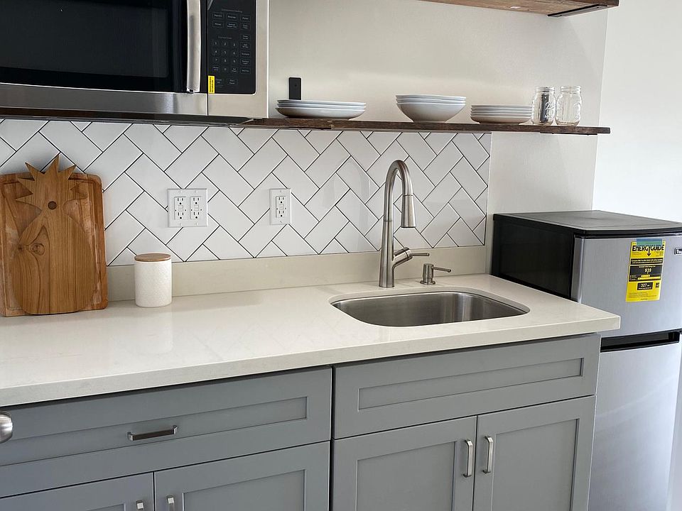 Kitchenette Nook with sink, microwave and refrigerator