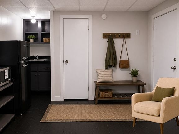View from west wall - photo is AI staged - unit is unfurnished