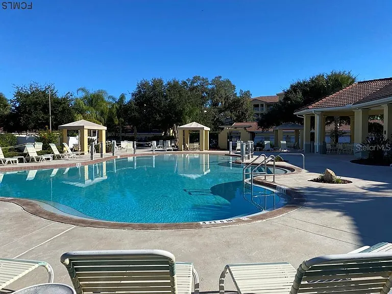Zero entry pool with lounge areas, grill area and cabanas