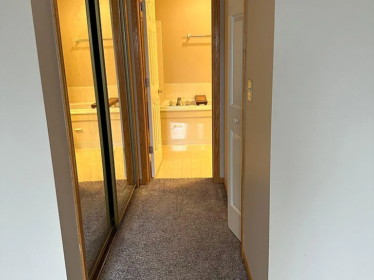 Closets and bathroom in main bedroom