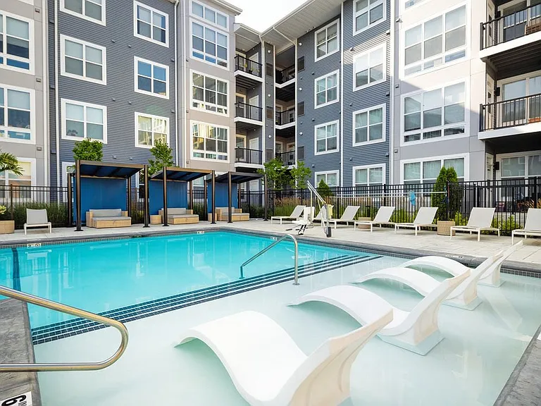 Swimming pool and sundeck with cabanas