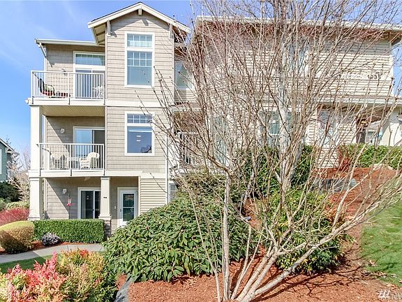 This photo shows how the 1006 sqft unit is ground level but has a second level deck. There is a unit below it that enters from the lower level. 