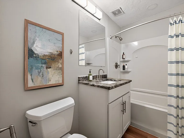 Elevate your living experience at Park Village West with this stylish bathroom featuring modern fixtures and serene decor. Enjoy the perfect blend of comfort and functionality. Schedule a tour today to see it in person!