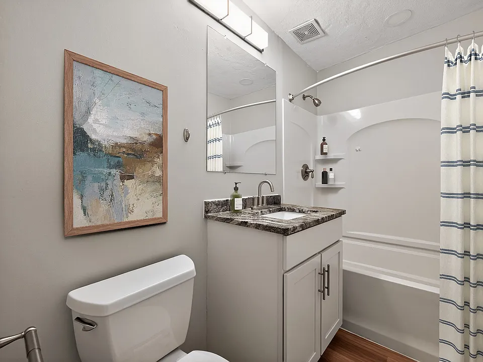 Elevate your living experience at Park Village West with this stylish bathroom featuring modern fixtures and serene decor. Enjoy the perfect blend of comfort and functionality. Schedule a tour today to see it in person!
