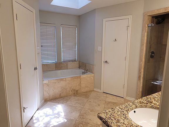 His and Hers closets master bath.