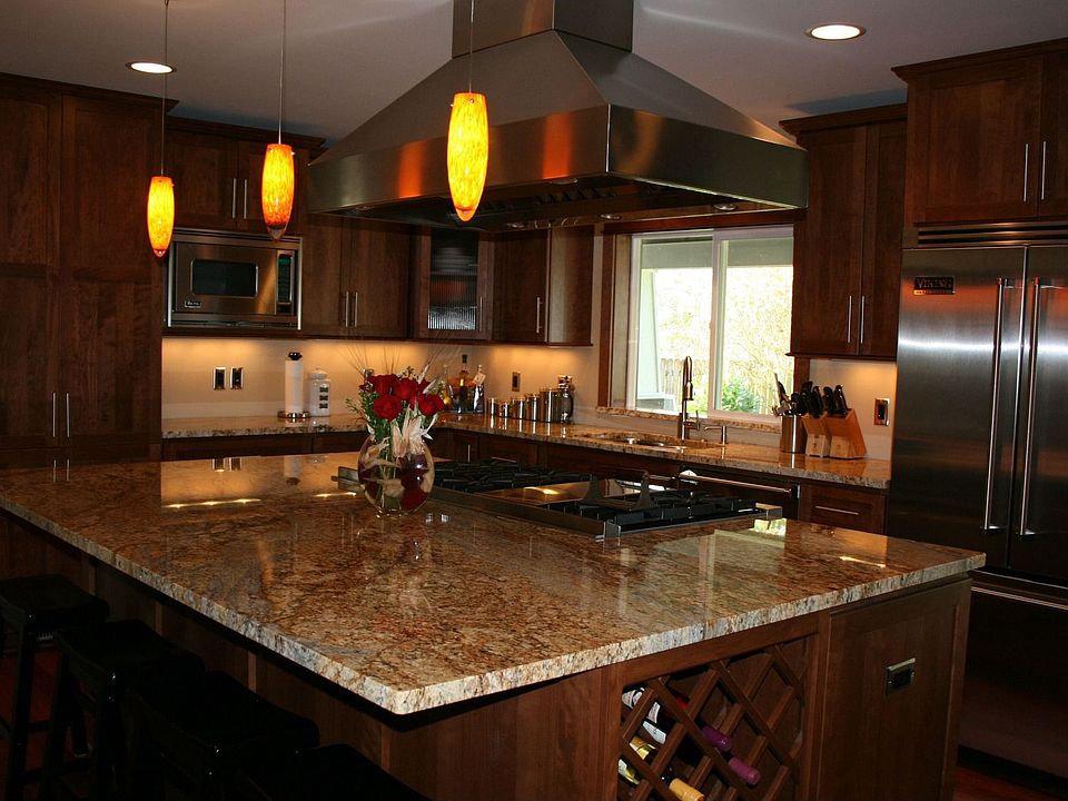 Chefs kitchen with cherry cabinets, slab granite, and Viking appliances.