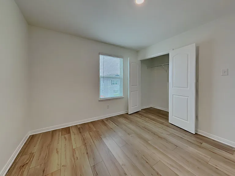 Brightly lit, spacious room wi