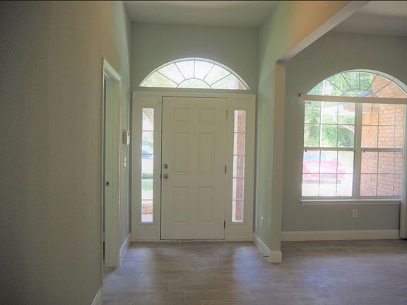 Entry way with office on the left and dining room on the right