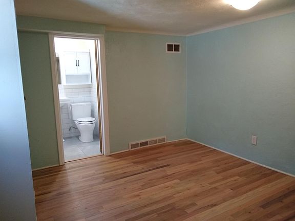 Beautiful refinished wood floors in living room and bedroom