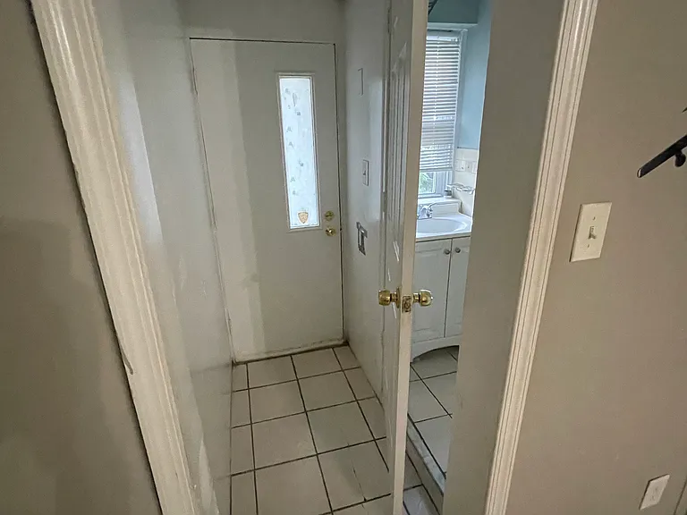 Door to bathroom and back door that leads to backyard.