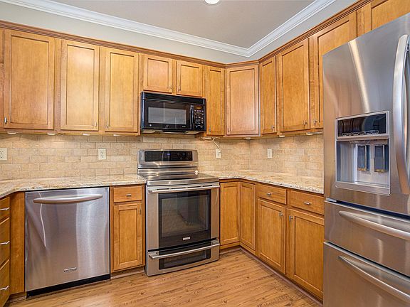 Gourmet kitchen with high end stainless steel appliances.