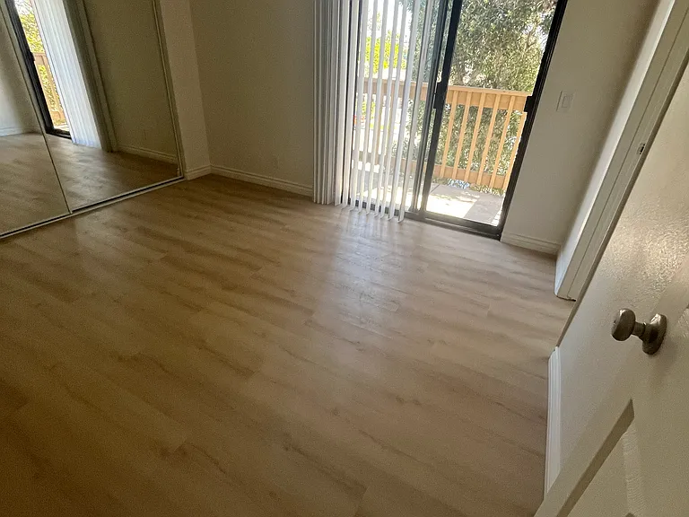 M BR w/Balcony/Tall Mirrored Clost Doors
