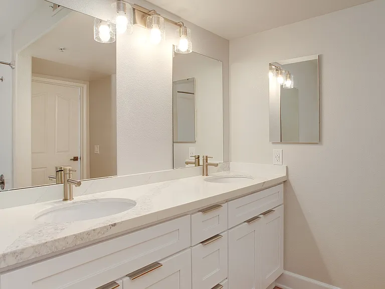 Master bathroom with granite countertops and large vanity