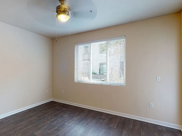 Apartment living room with wood-style flooring.