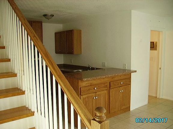 Peak at Kitchen Bar, and stairs to BR