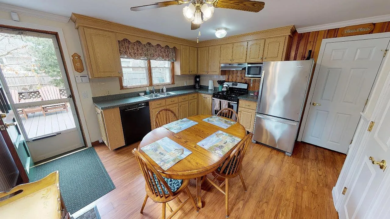 Relaxed Cape Living with 3 Bedrooms, Deck & Yard & Convenient Parking — Photo 3