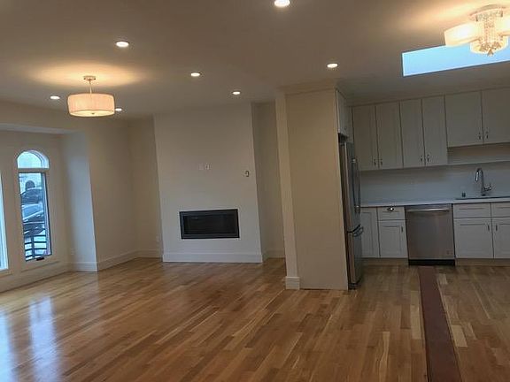 Open Living and Kitchen Area with Modern Fire Place
