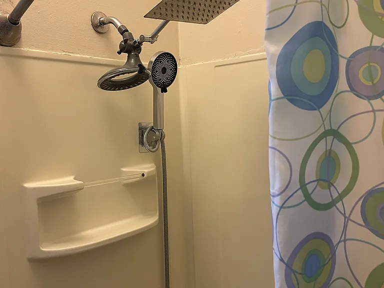 Versatile shower heads with handheld