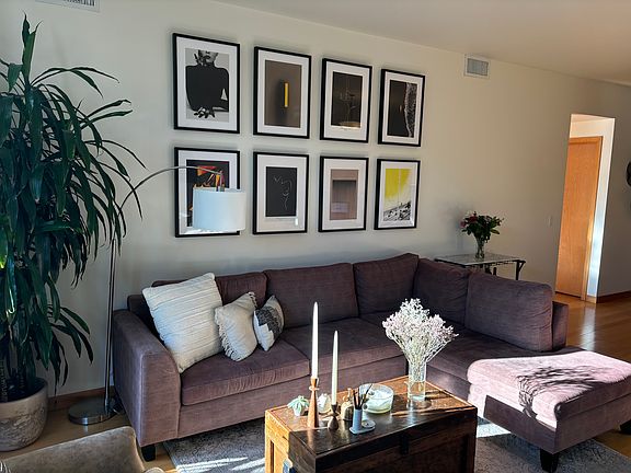 Gallery wall above couch in main living area.