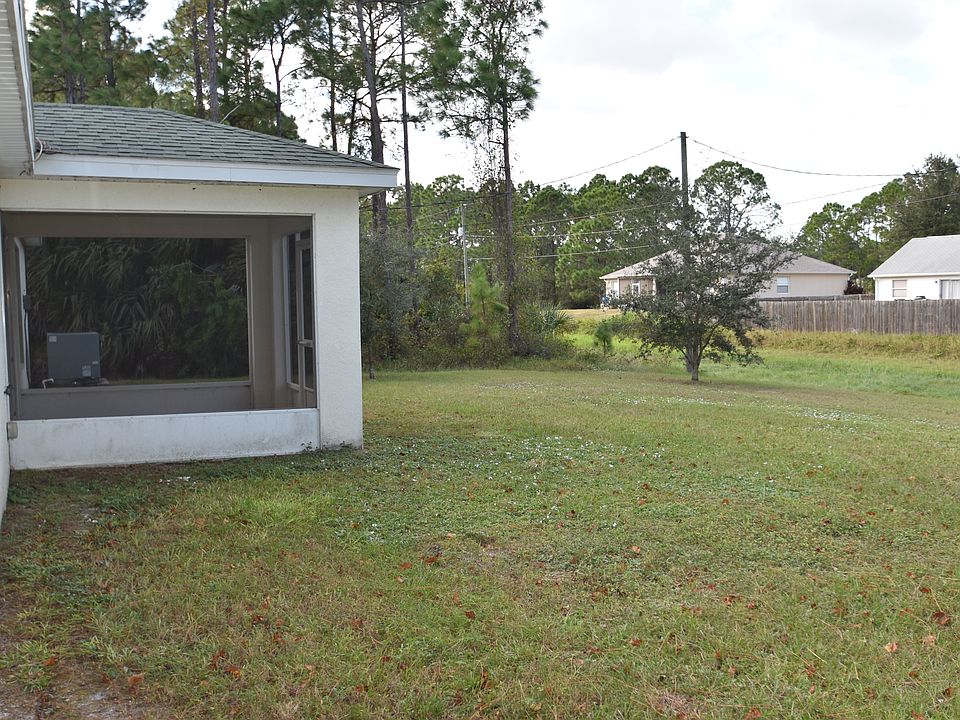 Back yard with screen patio