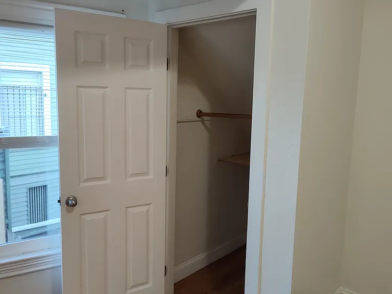 front bedroom with closet door open
