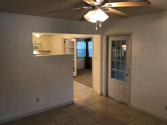 View from living room into kitchen and dining room