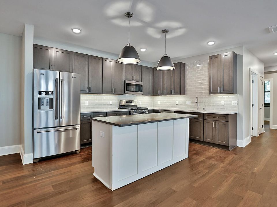 Kitchen with granite countertops and upgraded appliances
