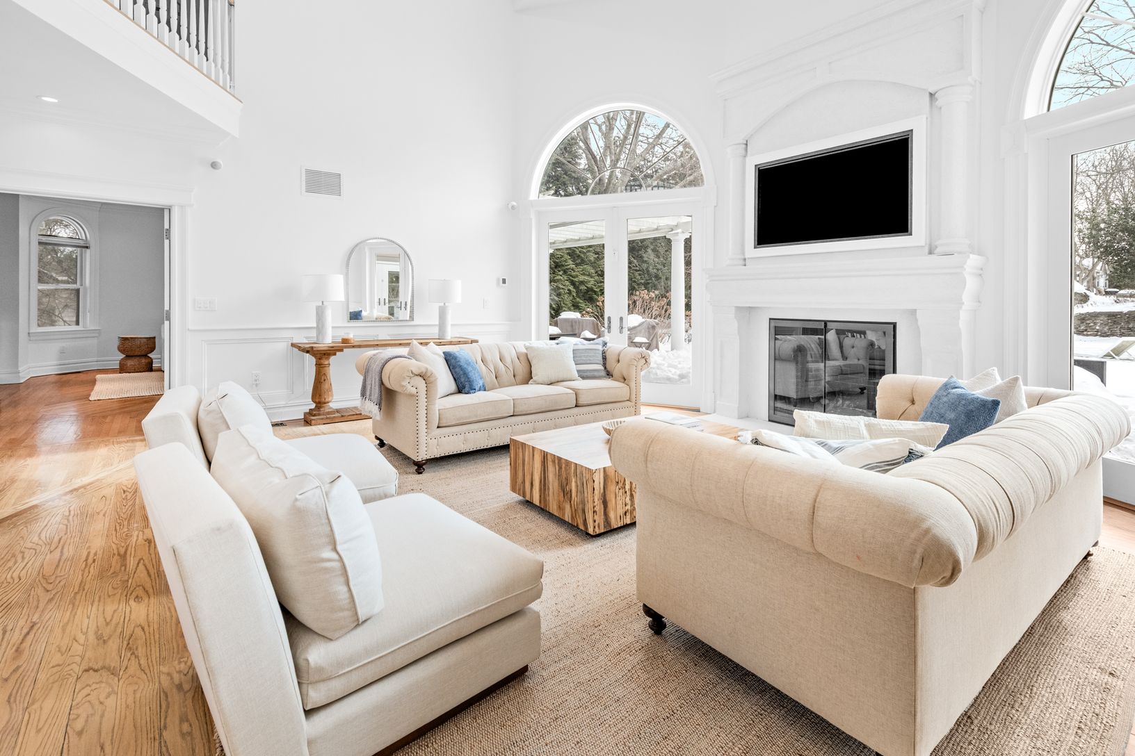  Grand living space filled with sunlight and dramatic ceiling heights