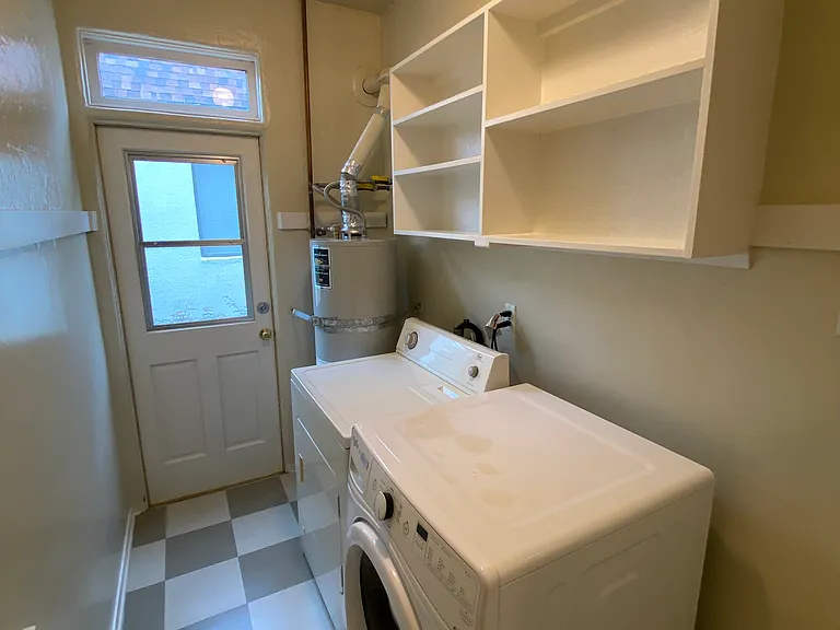 SEPARATE IN-UNIT LAUNDRY ROOM AND STORAGE CABINETS