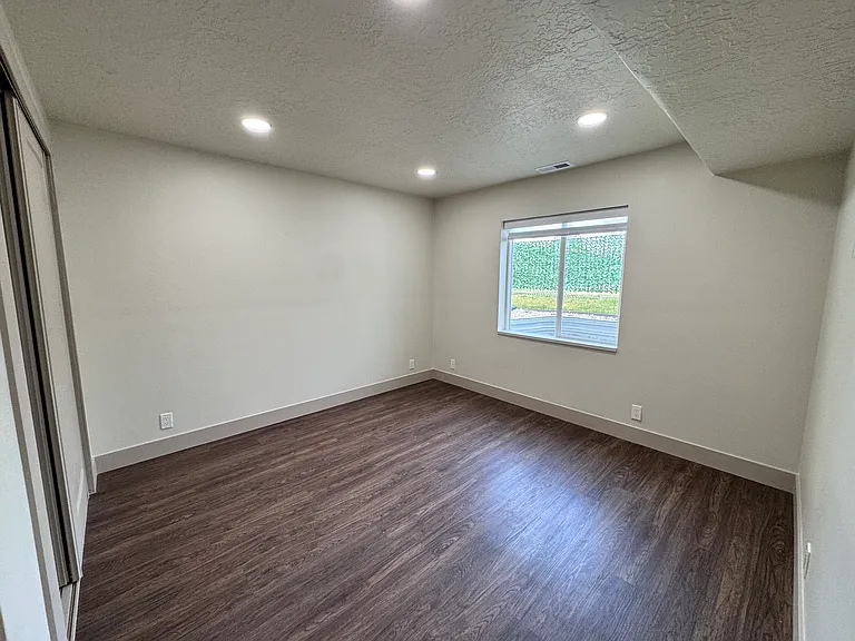 Comfortable third bedroom ideal for guests, kids, or a home office.