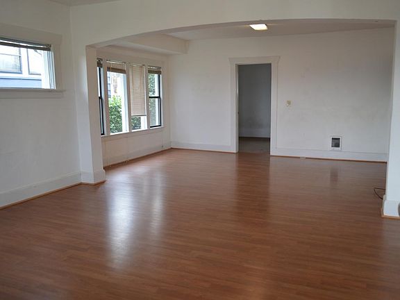 Living and dining area and a door leading to a bedroom on th