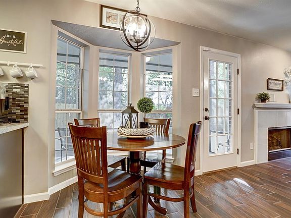 A lovely French door provides easy access to the huge, screened-in porch and outdoor deck.