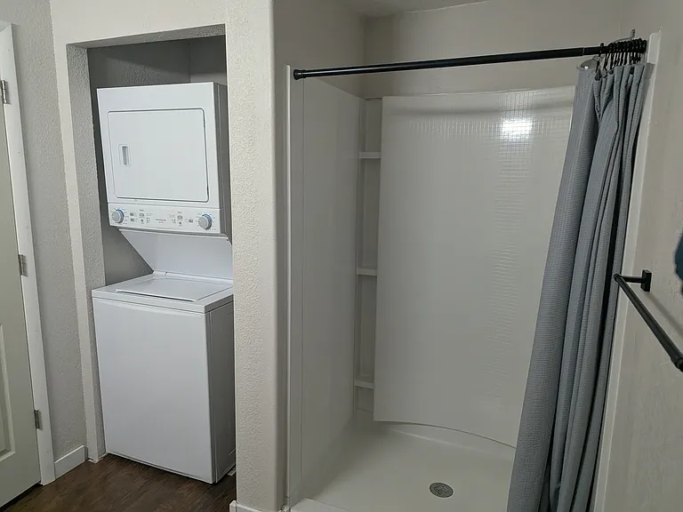 In-unit laundry next to shower