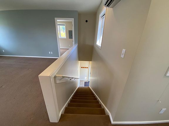 Stairs leading up from entrance to main living area.