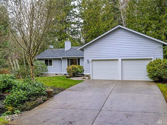 Large two car garage with separate doors.  One of the many upgraded features of this home.  New concrete driveway was done in 2010.