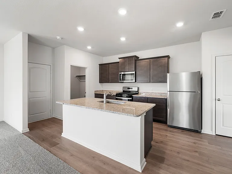 The kitchen of the Camelia has beautiful granite countertops.