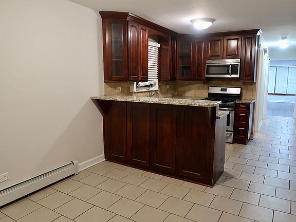 4th image of 6051 S Keating Ave APT 1