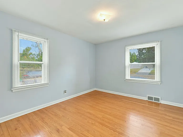 Master bedroom with a large sliding door closet.
