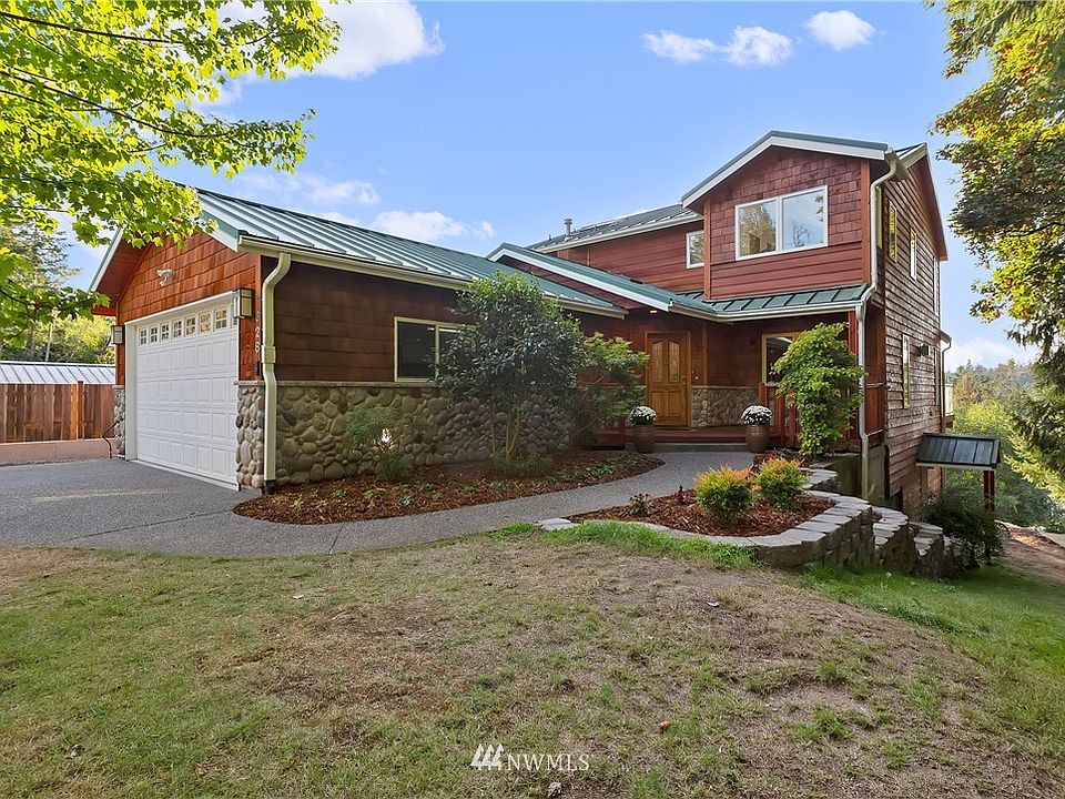 Classic Pacific Northwest style home. Notice the separate entrance to the unfinished basement.