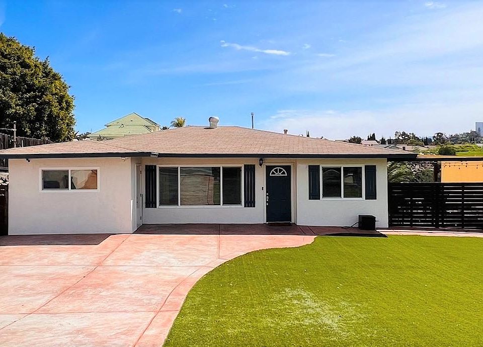 Large driveway and front yard.