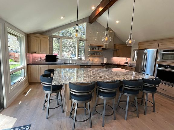 Large kitchen island for meal prep and dining.