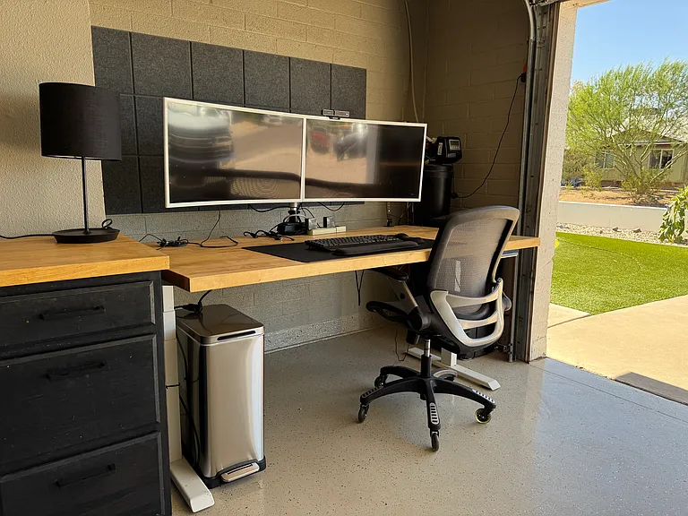 Climate control garage is fully-equipped with work-from-home set up (standing desk, LED lights, double monitors) and Smart TV