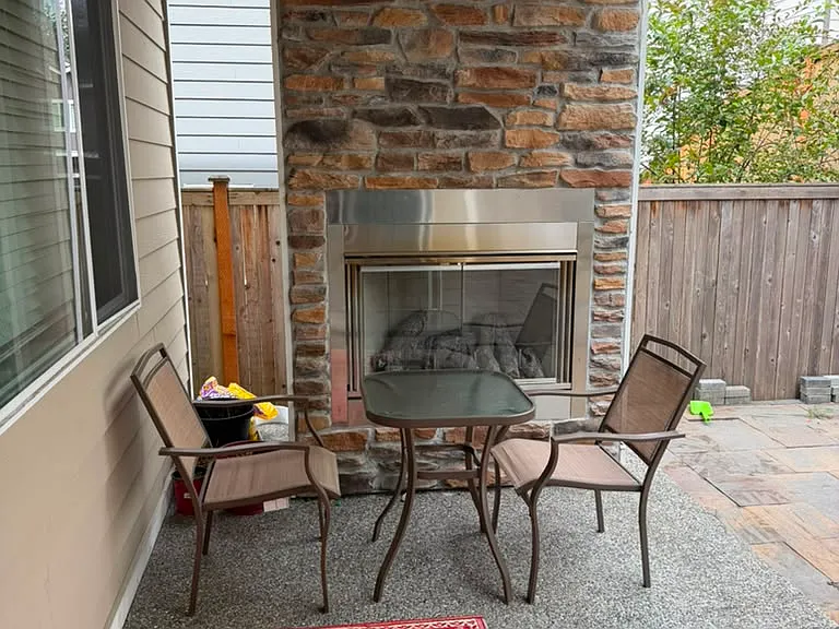 Covered Outdoor Living Area with Stone Gas Fireplace