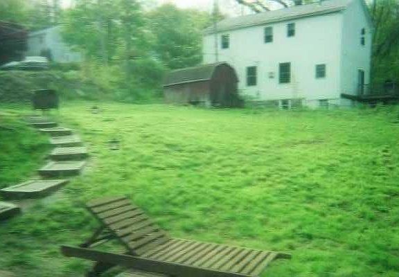 slope looks decieving, shed at end of yard 10 ft from line